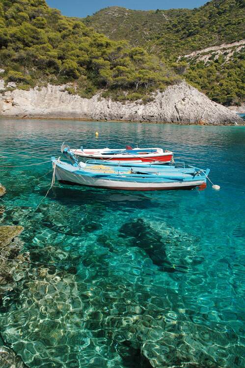 Image 4 kayaks on water for yoga in Greece